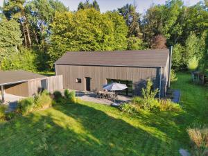 an overhead view of a barn with a yard at Wäller Haus - Modern villa with fireplace & large natural garden in Breitscheid