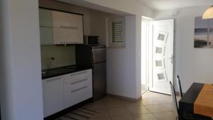 Kuchyň nebo kuchyňský kout v ubytování Gavza Luna Apartment