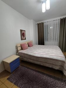 Ένα ή περισσότερα κρεβάτια σε δωμάτιο στο Mimo house +3 φωτογραφίες