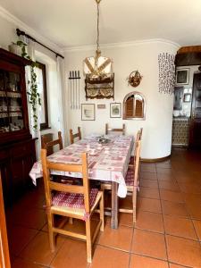 a dining room with a table and chairs at Le Pergole in Trieste