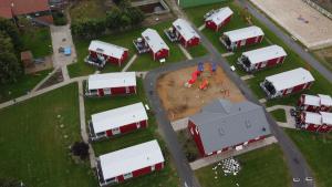 an aerial view of a model of a farm with trucks and trailers at Ferienhof Schild - Das kleine Bullerbü am Meer in Wangerland