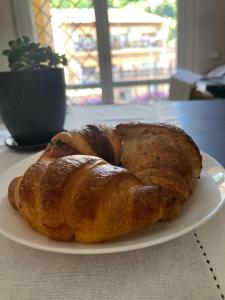 a plate of croissants and potatoes on a table at I Portici Affittacamere in Valmontone
