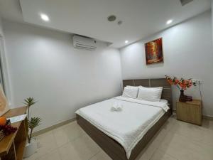 Ένα ή περισσότερα κρεβάτια σε δωμάτιο στο Ruby Star Hotel - Apartment Biển Vũng Tàu