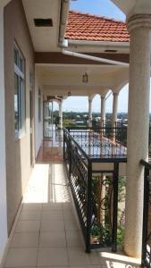 a balcony of a house with a view of a building at ROSEVILLA HOTEL Limited in Arua