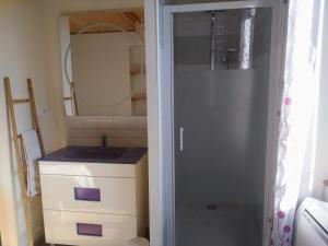 a bathroom with a sink and a mirror at Gîte Tour du Rocher in Luzech +20 photos