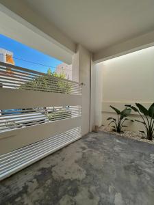 a balcony of a house with plants in it at SQUARE 45 in Chania Town +30 photos
