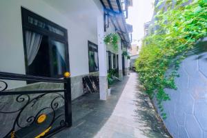 an alley with a railing next to a building at Mây Hoa Tiên Villa - House in Da Lat +203 photos