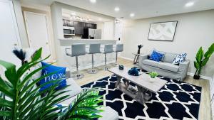 a living room with a couch and a table at Lavish Escape in Charlotte