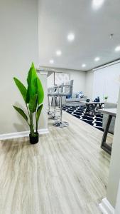 a office with a plant in the middle of a room at Lavish Escape in Charlotte