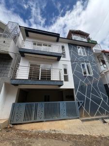 a building with a mural on the side of it at Iris Groove Ooty by Avkanz in Ooty