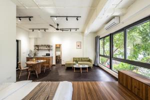 an open living room with a large window at CANAVERAL Residence near Hoan Kiem-OUTSTANDING Rooftop with Private Pool in Hanoi