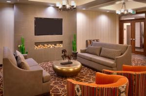 a living room with couches and a fire place at Holiday Inn Express & Suites Kanab by IHG in Kanab