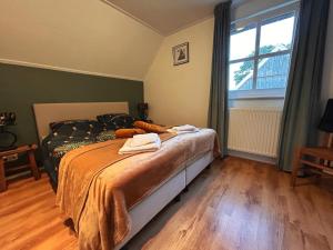 Postel nebo postele na pokoji v ubytování B&B Erve Möskert