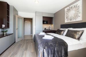 Postel nebo postele na pokoji v ubytování Hotel Awam