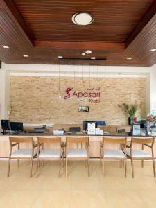 a restaurant with a table and chairs in a lobby at Apasari Krabi - SHA Extra Plus in Ao Nang Beach +56 photos