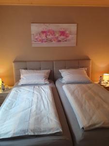two beds sitting next to each other in a room at Wünschel Stube in Gossersweiler-Stein +44 photos