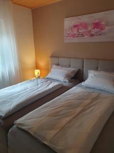 two beds sitting next to each other in a room at Wünschel Stube in Gossersweiler-Stein