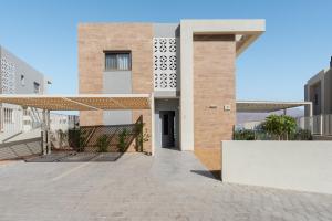 a building with a walkway in front of it at Villa Dekel - By Harim in Eilat