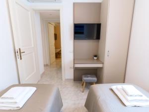 TV a/nebo společenská místnost v ubytování Casa Fiore Plus Appartamento Superior