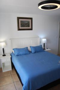 Giường trong phòng chung tại Glentana Hoboken Holiday Cottage