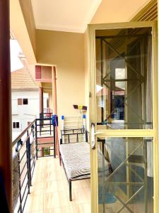 a balcony with a glass door and a bench at Cozy & comfy in Kira +2 photos