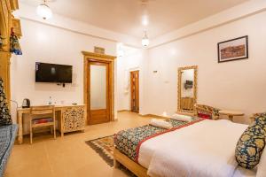 Μια τηλεόραση ή/και κέντρο ψυχαγωγίας στο Hotel Govind Fort +11 φωτογραφίες
