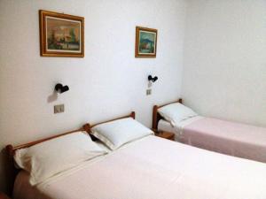 Postel nebo postele na pokoji v ubytování Hotel Europa