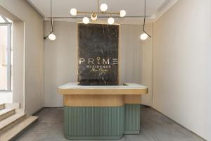 a counter in a room with a sign on the wall at Prime Residence New Cairo in Cairo