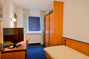 Postel nebo postele na pokoji v ubytování Panorama Hotel + 30 fotografií