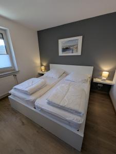 Ένα ή περισσότερα κρεβάτια σε δωμάτιο στο Nige Ooge FeWo 9