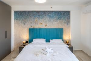 Ένα ή περισσότερα κρεβάτια σε δωμάτιο στο Offshore Suites Apartments in St Julians Centre
