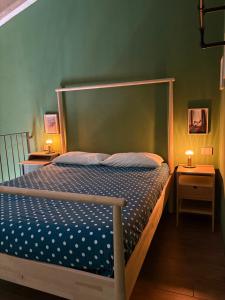 a bedroom with a bed and two night stands at Sala dell Estate Guest House in Secchia +206 photos
