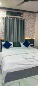 Postel nebo postele na pokoji v ubytování Ananya guest house