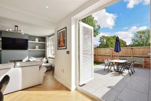 a living room with a couch and a table at Gated Driveway Walk To City Center 7 Mins New in Hereford