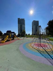 a park with a playground with a slide at Skyline 15 Milano - Panoramic Apartment and Free Parking - Metro M1 in Milan