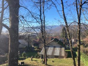 a view of a house with mountains in the background at Maison deux chambres avec grand jardin in Grésy-sur-Aix +1 photo
