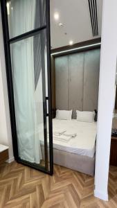 Ένα ή περισσότερα κρεβάτια σε δωμάτιο στο Premium Apartment 14th Floor Nest one