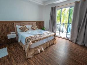 Postel nebo postele na pokoji v ubytování Alma Maldiva, Beach Hotel