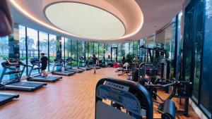 a gym with people exercising on treadmills in a building at Trion Residence Kuala Lumpur BY Sky Rainbow in Kuala Lumpur