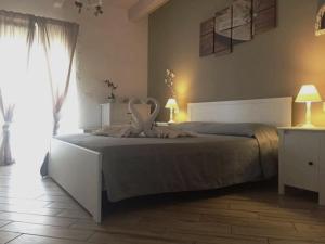 Postel nebo postele na pokoji v ubytování Spegni La Luce b&b