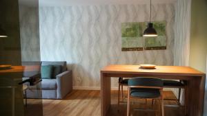 a dining room with a table and a chair at GW Apartment 1 in Meppen