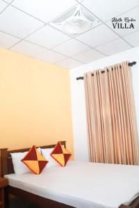 Giường trong phòng chung tại Aluth Gedara Villa +1 ảnh