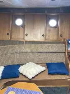 a view of the back of a boat with two windows at LOTOSS ex ice class Pilot ship in Engure