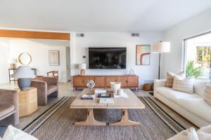 a living room with a couch and a table at Architectural Villa for Groups 16 Pax in Palm Springs +16 photos