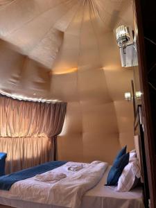 a room with a bed in a tent at Milky Way Luxury Camp in Wadi Rum