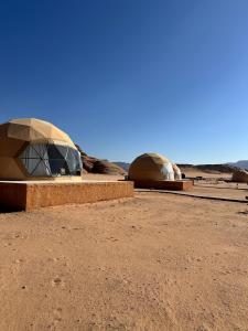 two domes in the middle of the desert at Milky Way Luxury Camp in Wadi Rum