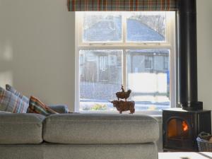 Posezení v ubytování Uaine Cottage