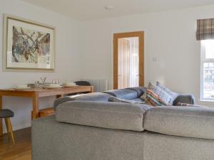 Posezení v ubytování Uaine Cottage