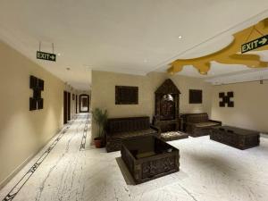a large living room with couches and tables in it at Hotel Perfect, Karol Bagh, 2 mins walk from metro station in New Delhi