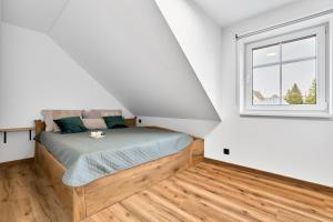 Postel nebo postele na pokoji v ubytování Apartment K&L Boží Dar